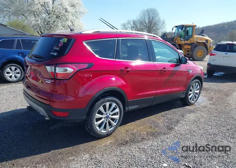 2017 Ford Escape Titanium z USA, uszkodzony, nr VIN 1FMCU0J96HUE04046